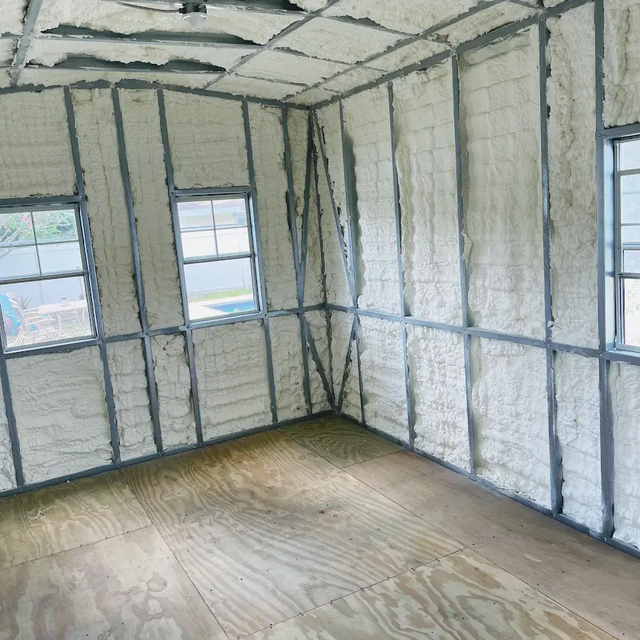 Closed-cell spray foam insulation applied to wall cavities in a residential project in Tichigan